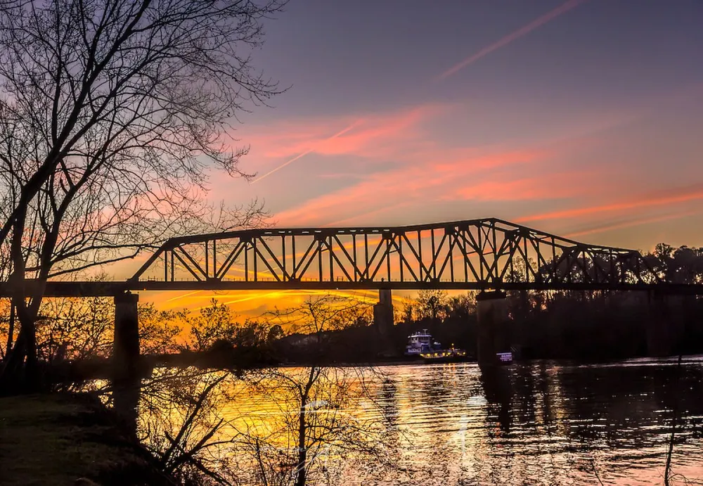 Trestle bridge over the Black Warrior River at sunset in Tuscaloosa